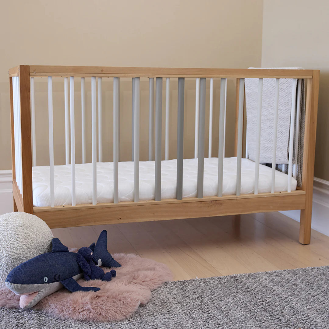 waterproof mattress in a cot bed